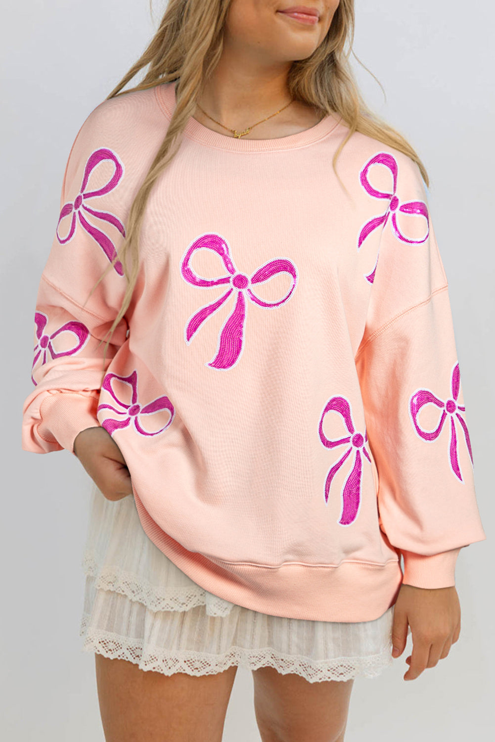 Sweatshirts & Hoodies- Oversized Sweatshirt with Sequined Bows- Apricot Pink- IndioGear Women Clothing